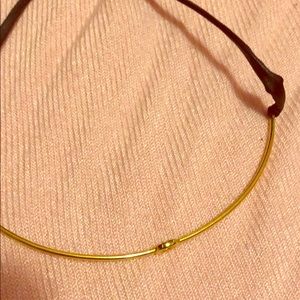 Gold choker with leather straps